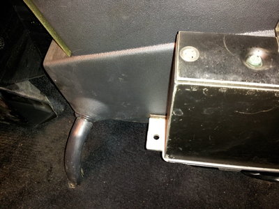 Bottom left of the passenger side